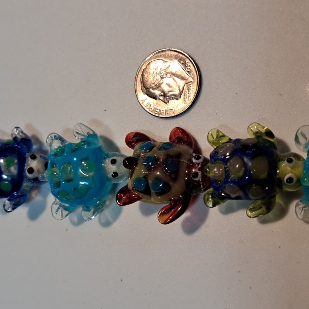 Vintage handmade glass beads of colorful turtles